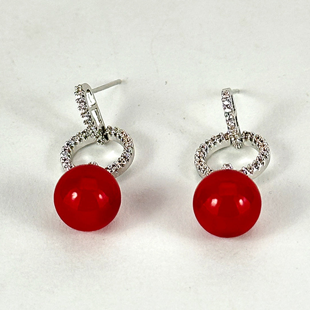 (Red Pearl Radiance Earrings) shown in close up from Al Musk Jewellery collection.