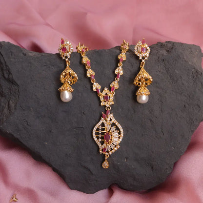 (Ruby CZ Indian Necklace Set with long Pear Earrings) shown in close up from Al Musk Jewellery collection.